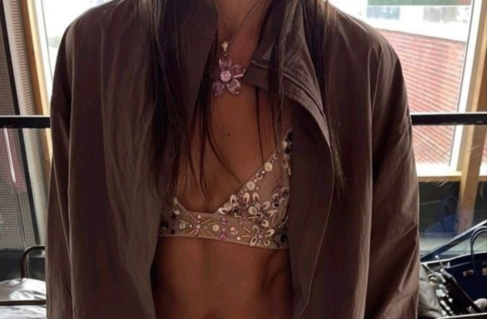 women wearing mesh sparkle bralette with blazer