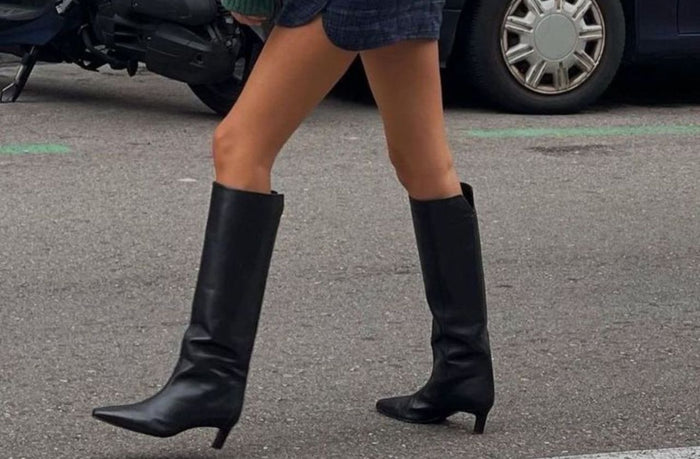 petite women wearing black knee high boot on the street