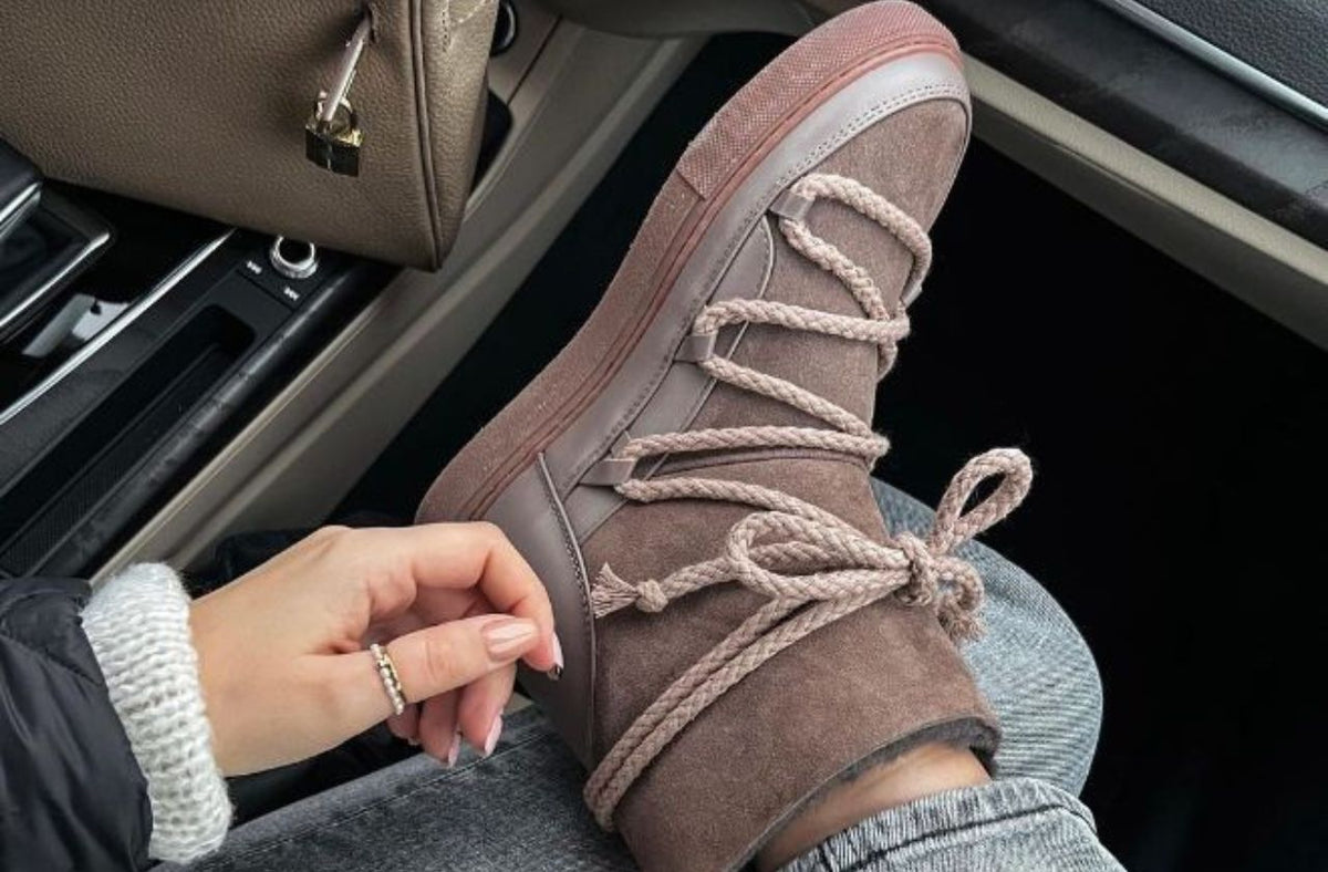 women wearing cute walking boot for cold weather in the car