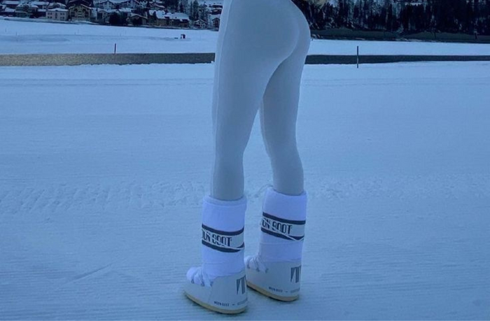 white designer snow boots with legging.png