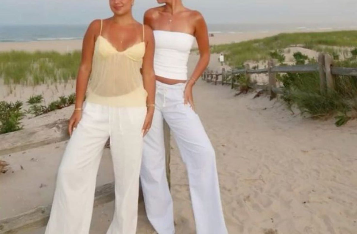 petite girls on the beach wearing linen pants in white summer style